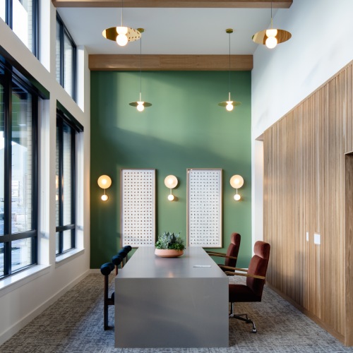 a lobby with a front desk and chairs
