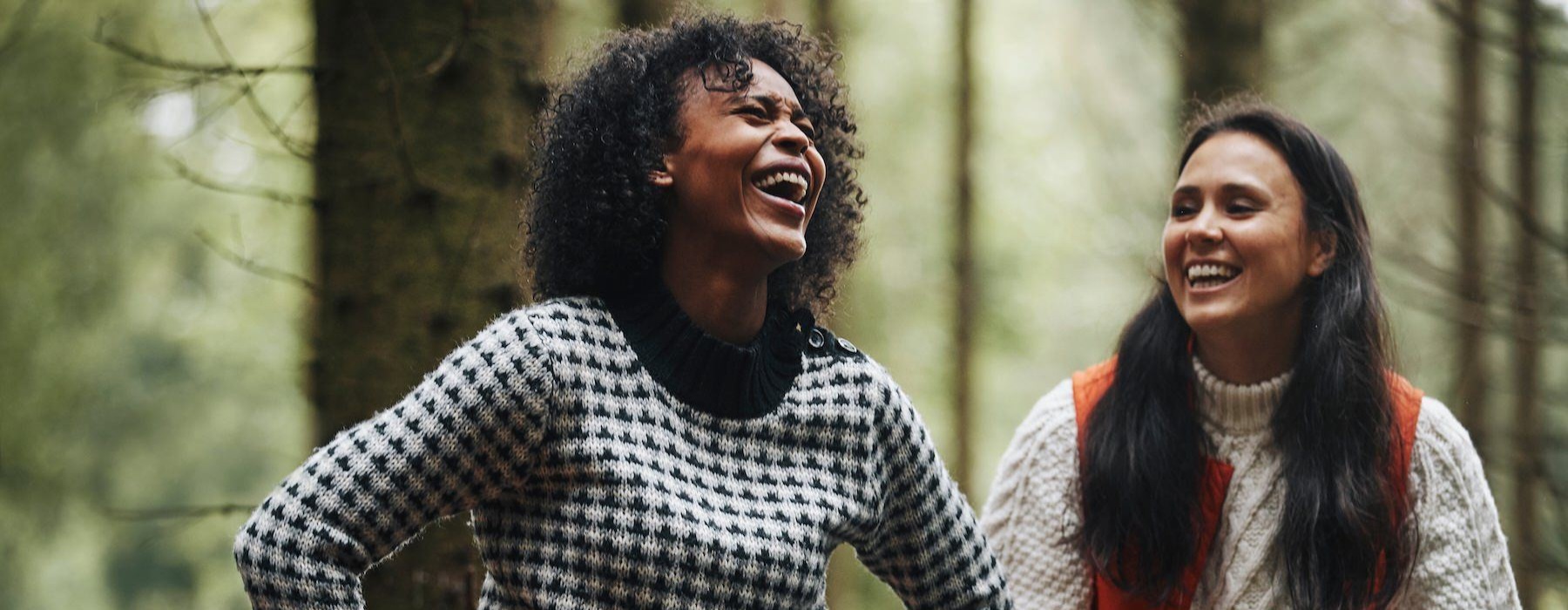 friends laughing in the woods
